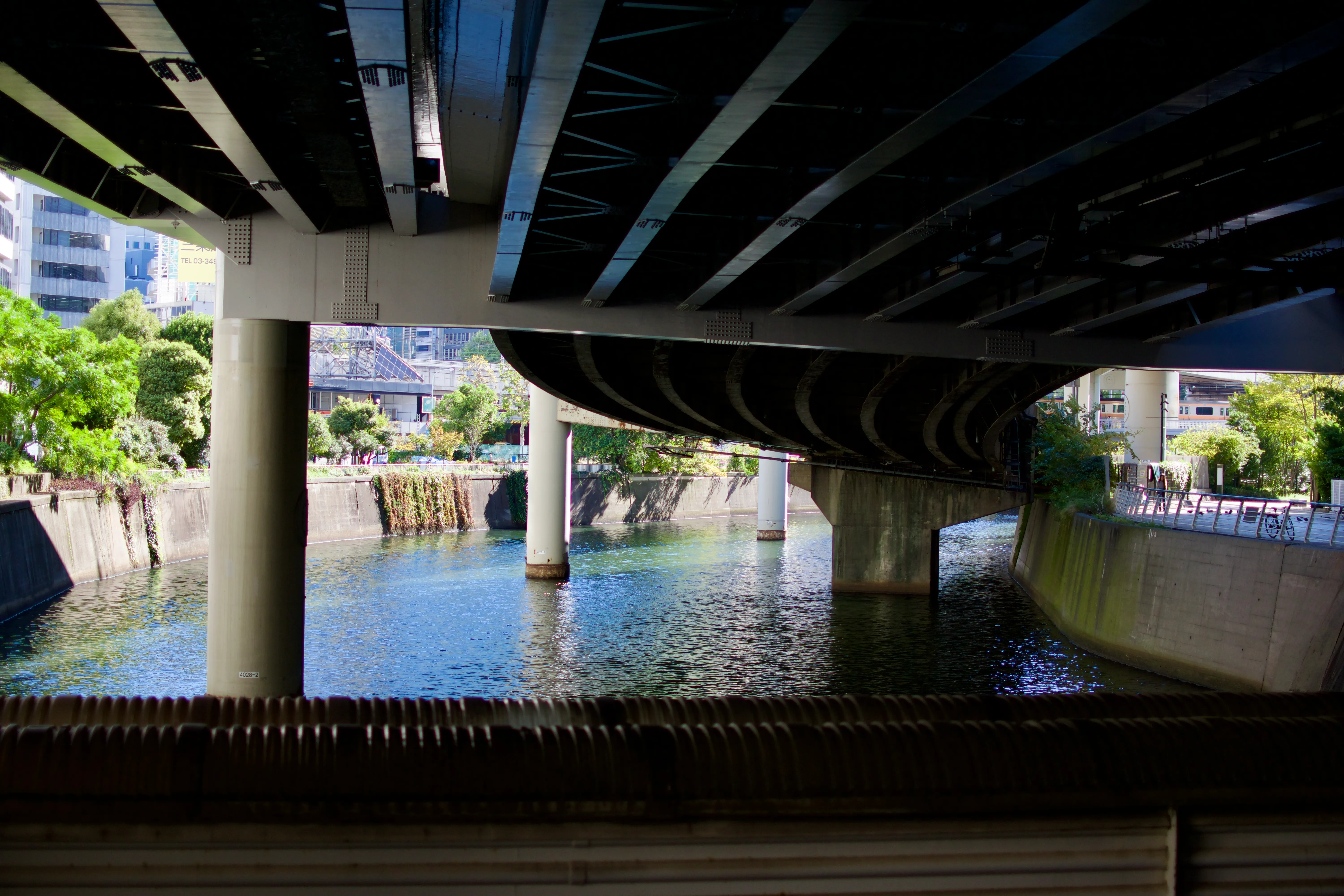 The underside of an expressway elevated over the Nihonbashi River, as seen from Kamakurabashi