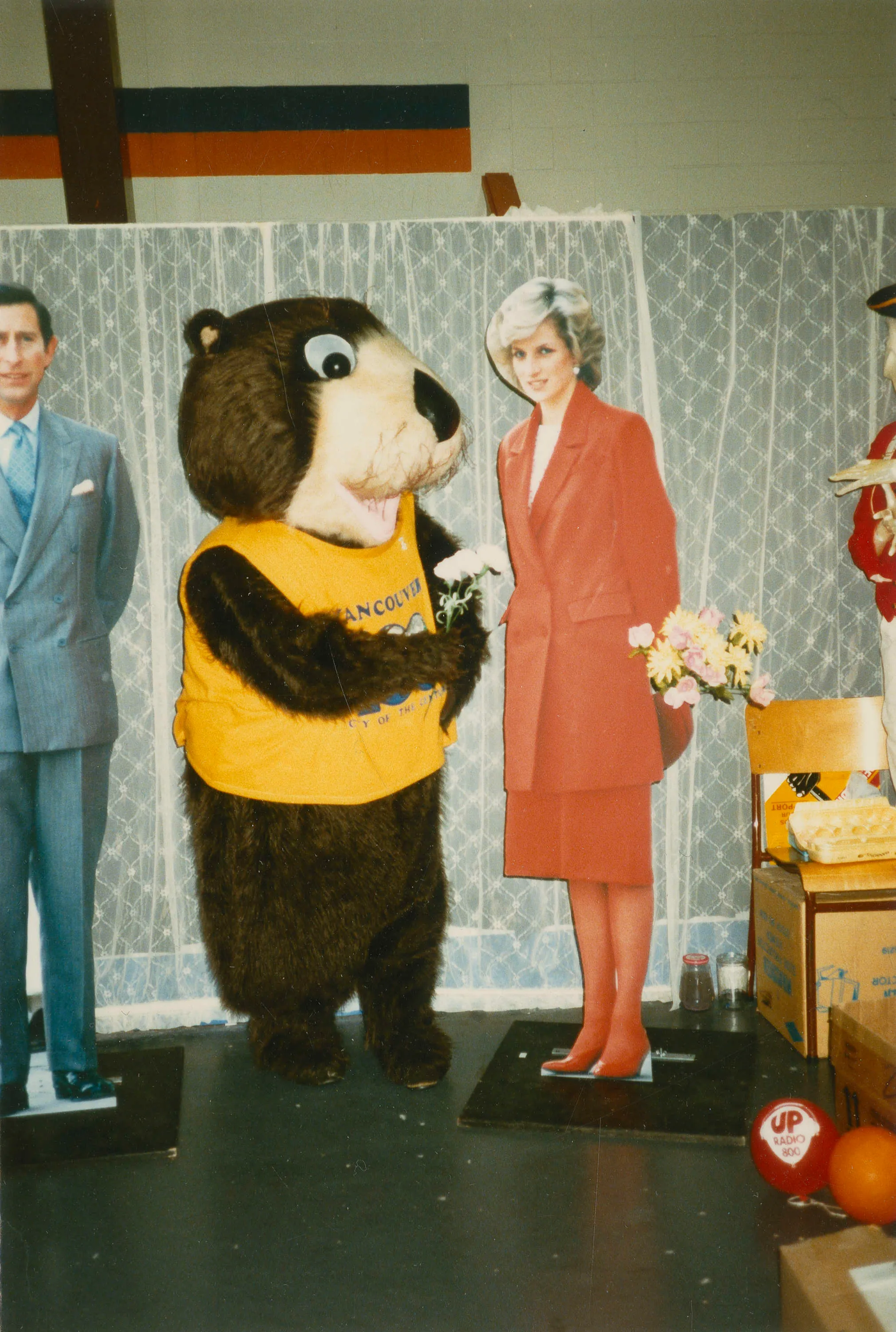 Tillicum standing beside Prince Charles and Princess Diana cutouts