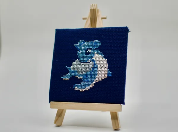 A cross-stitch of the transport Pokémon Lapras