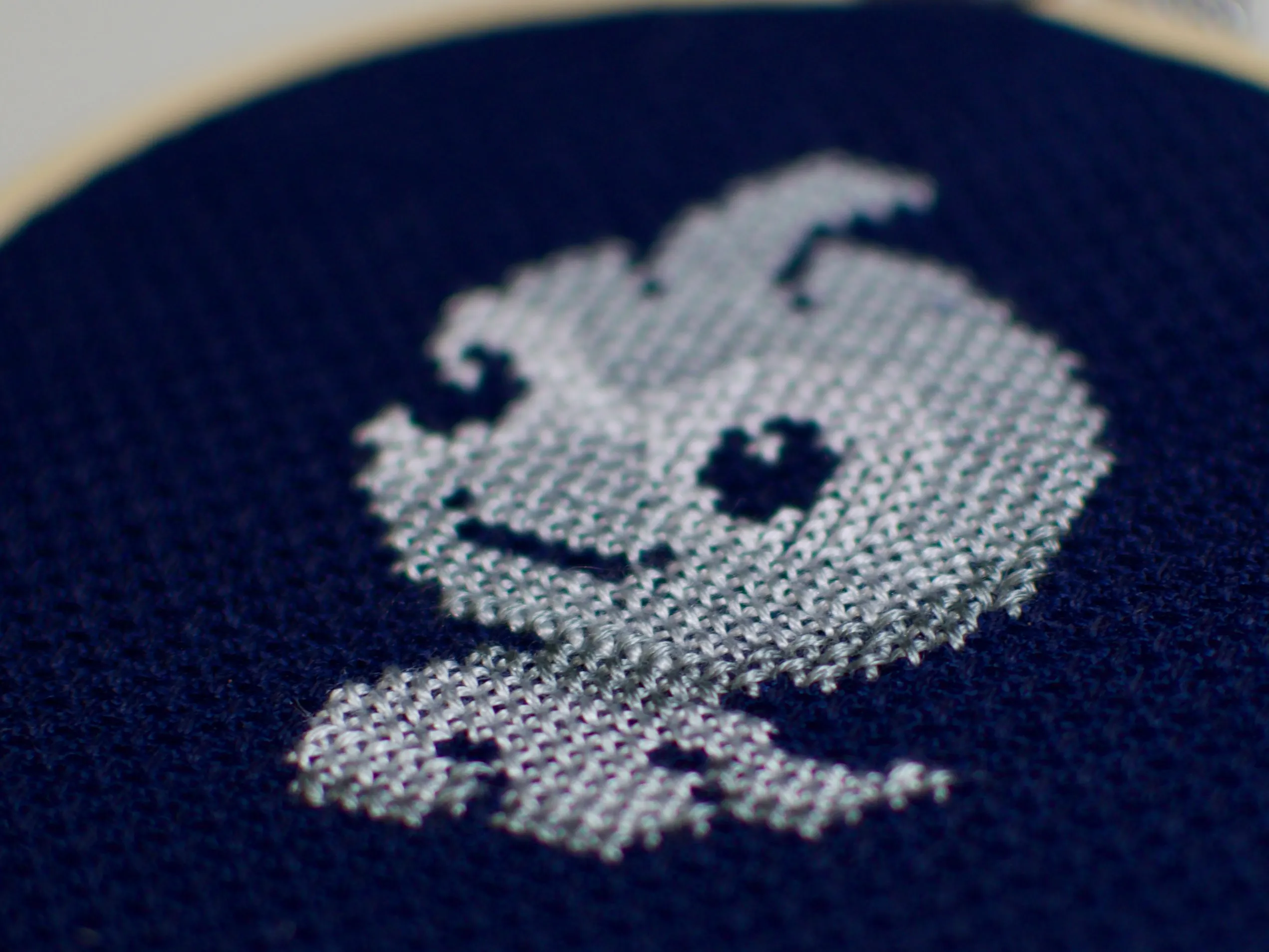 A small cross-stitch of the weather Pokémon Castform