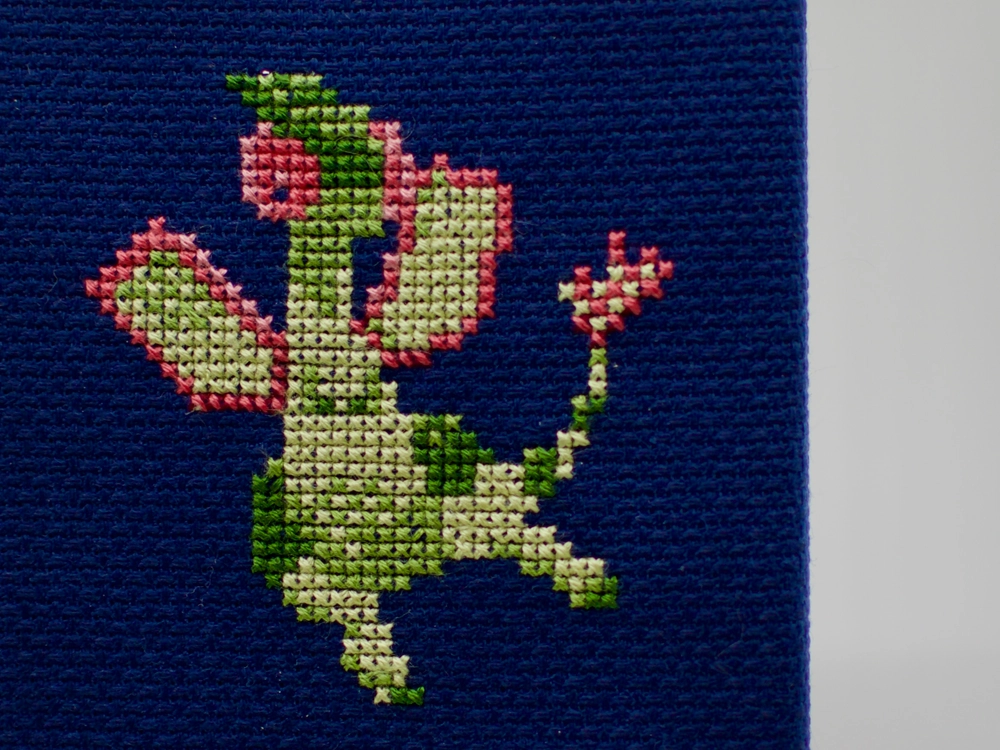 A cross-stitch of the mystic Pokémon Flygon