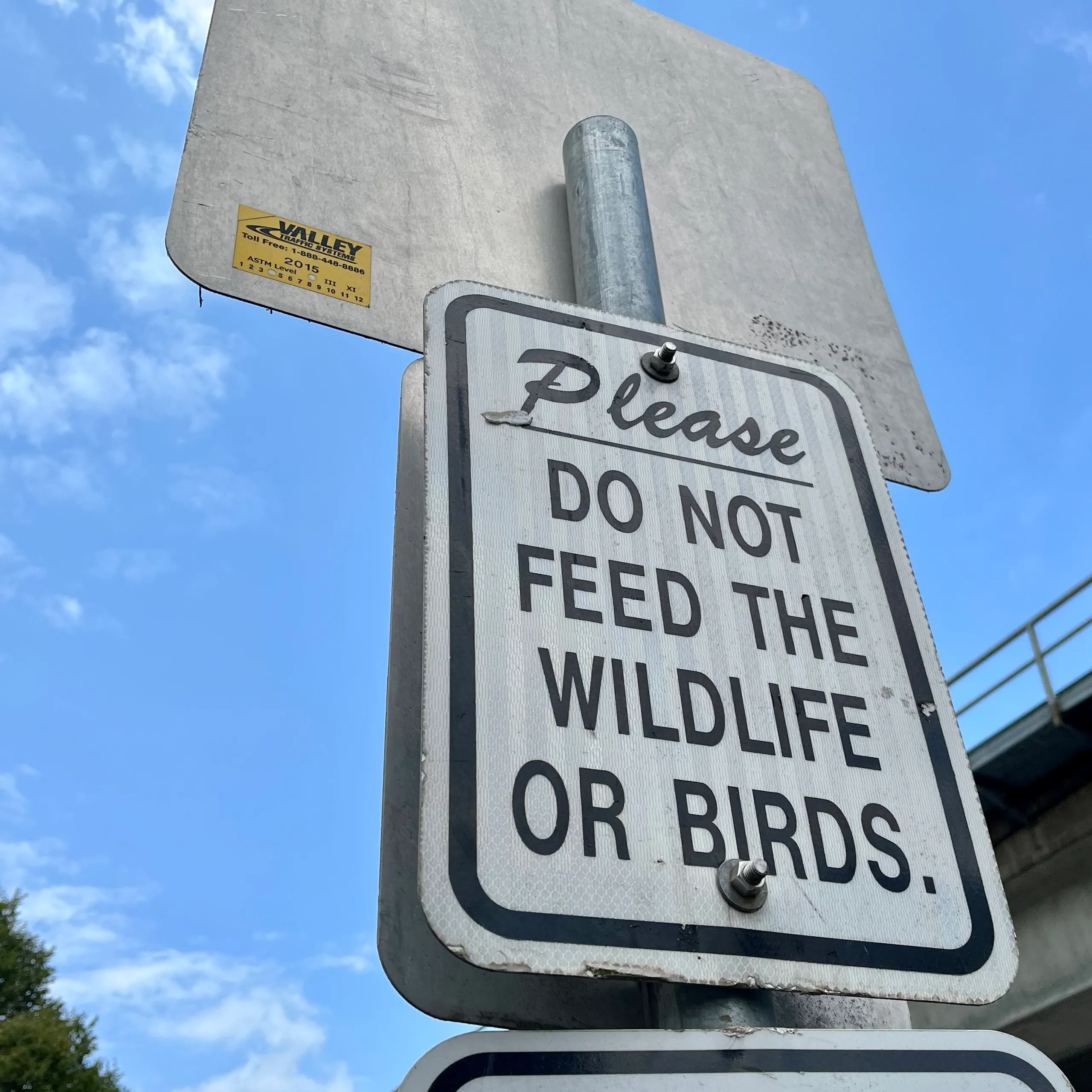 A sign reads 'Do not feed the wildlife or birds'