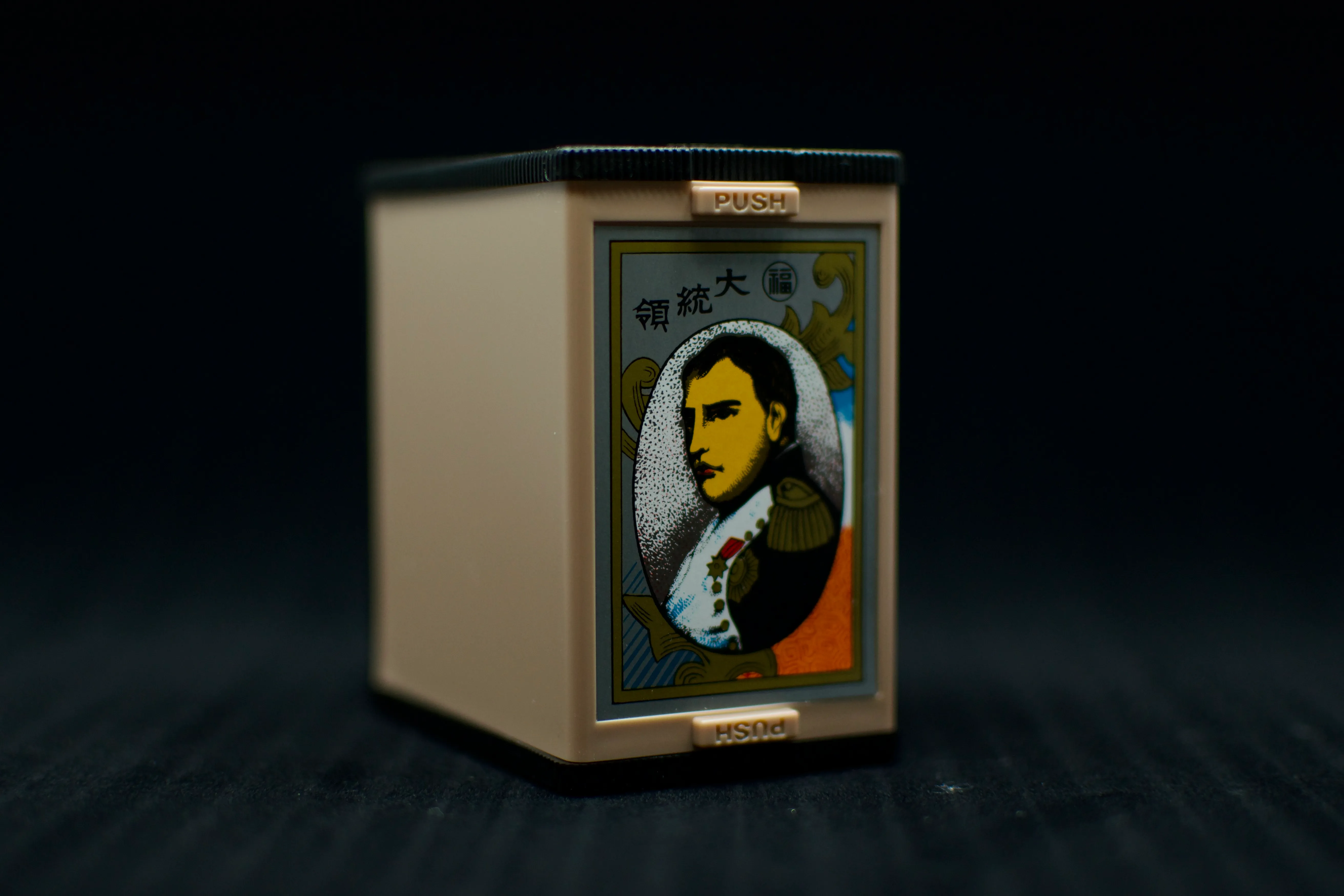 A plastic box adorned with a portrait of Napoleon Bonaparte