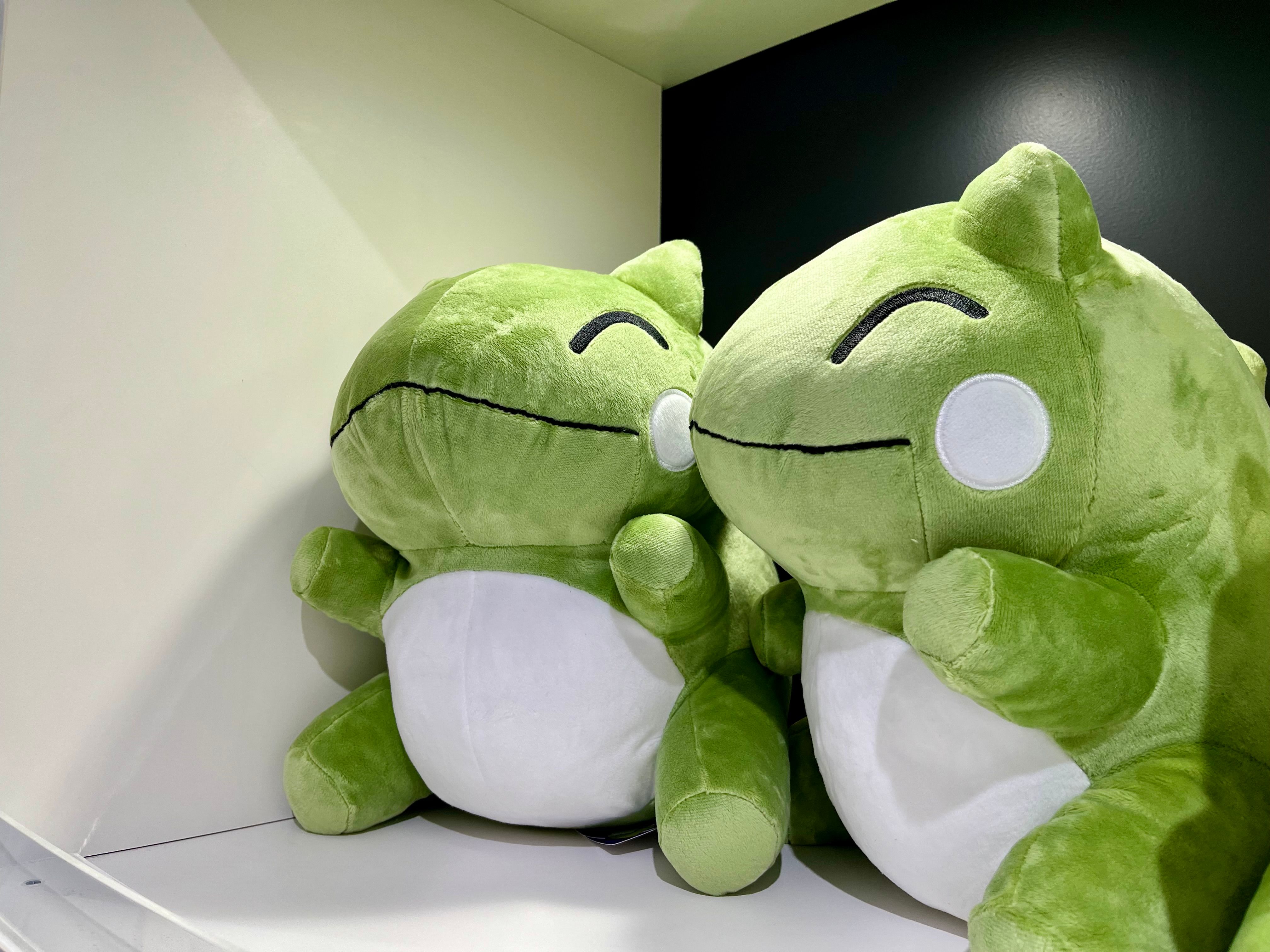 Two smiling plushies in a cubby, shaped like the generic Pokémon doll created from the move Substitute.